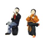 A PAIR OF CHINESE FIGURES OF OPIUM SMOKERS