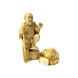 AN EARLY 20TH CENTURY JAPANESE IVORY CARVING AND A NETSUKE