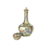 A CHINESE CANTON FAMILLE ROSE BOTTLE SHAPED VASE AND A LIDDED JAR AND A FAMILLE ROSE LIDDED JAR