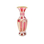 A LATE 19TH CENTURY BOHEMIAN CRANBERRY GLASS VASE