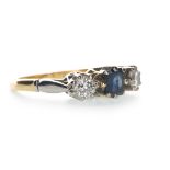 A BLUE GEM SET AND MOISSANITE THREE STONE RING