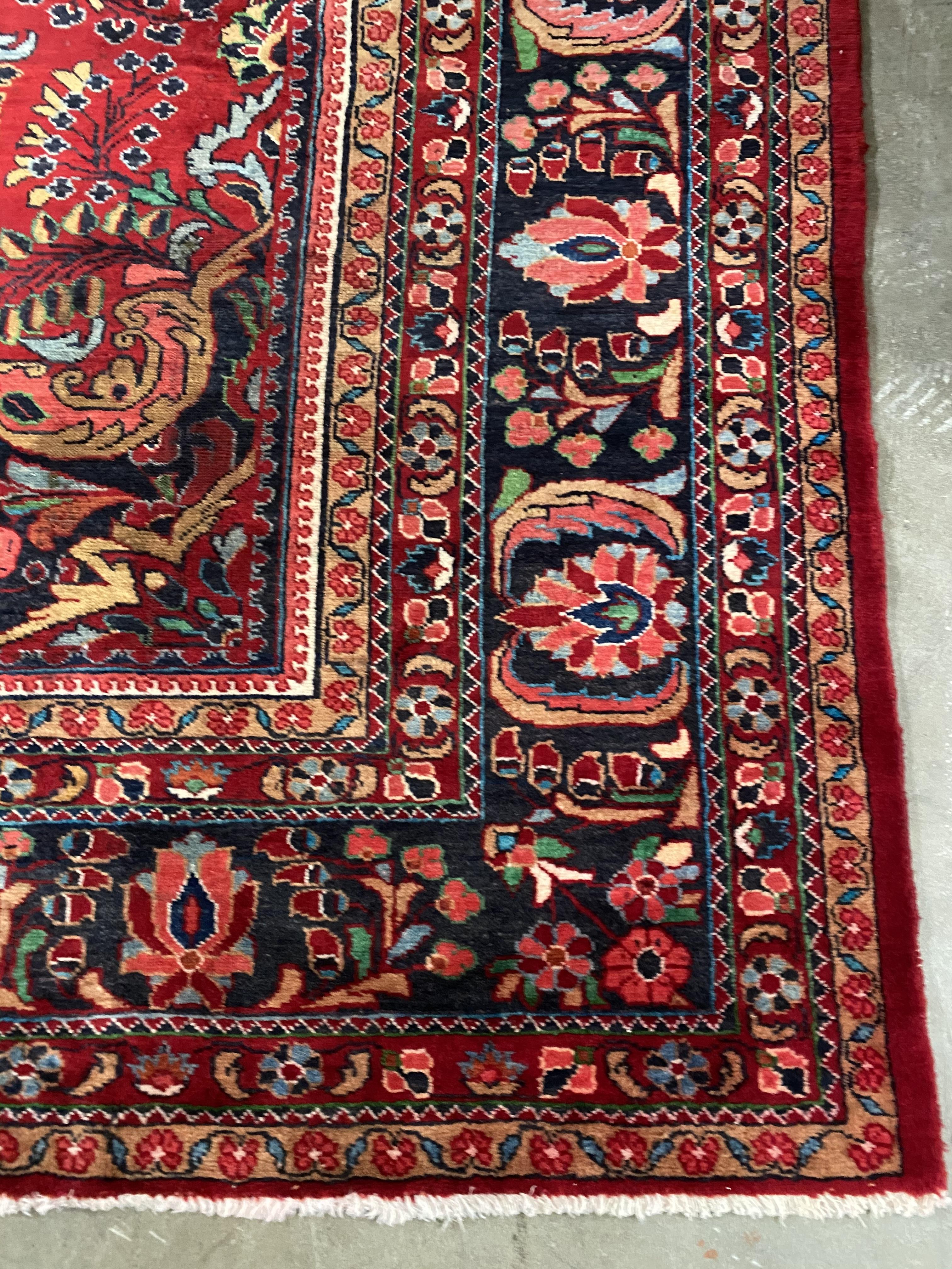 A MID-20TH CENTURY HAND-KNOTTED PERSIAN CARPET