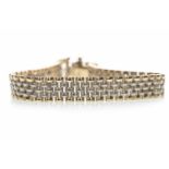 A NINE CARAT GOLD BI COLOUR BRACELET