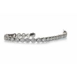 A DIAMOND TENNIS BRACELET