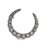 A DIAMOND CRESCENT MOON BROOCH