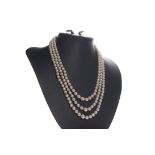 A THREE STRAND PEARL NECKLACE