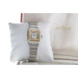 A LADY'S CARTIER SANTOS BI COLOUR STAINLESS STEEL QUARTZ WRIST WATCH