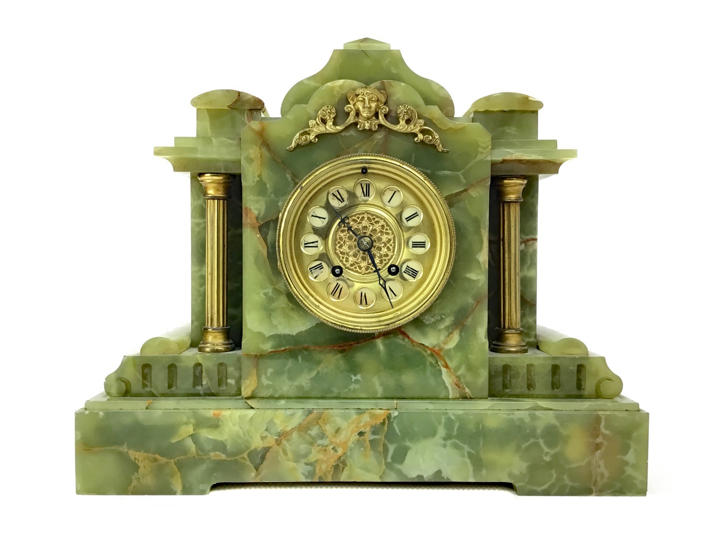 A LATE VICTORIAN GILT AND ONYX MANTEL CLOCK