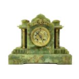 A LATE VICTORIAN GILT AND ONYX MANTEL CLOCK