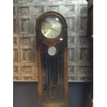 AN EARLY 20TH CENTURY OAK LONGCASE CLOCK