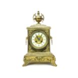 AN EARLY 20TH CENTURY GILT METAL MANTEL CLOCK