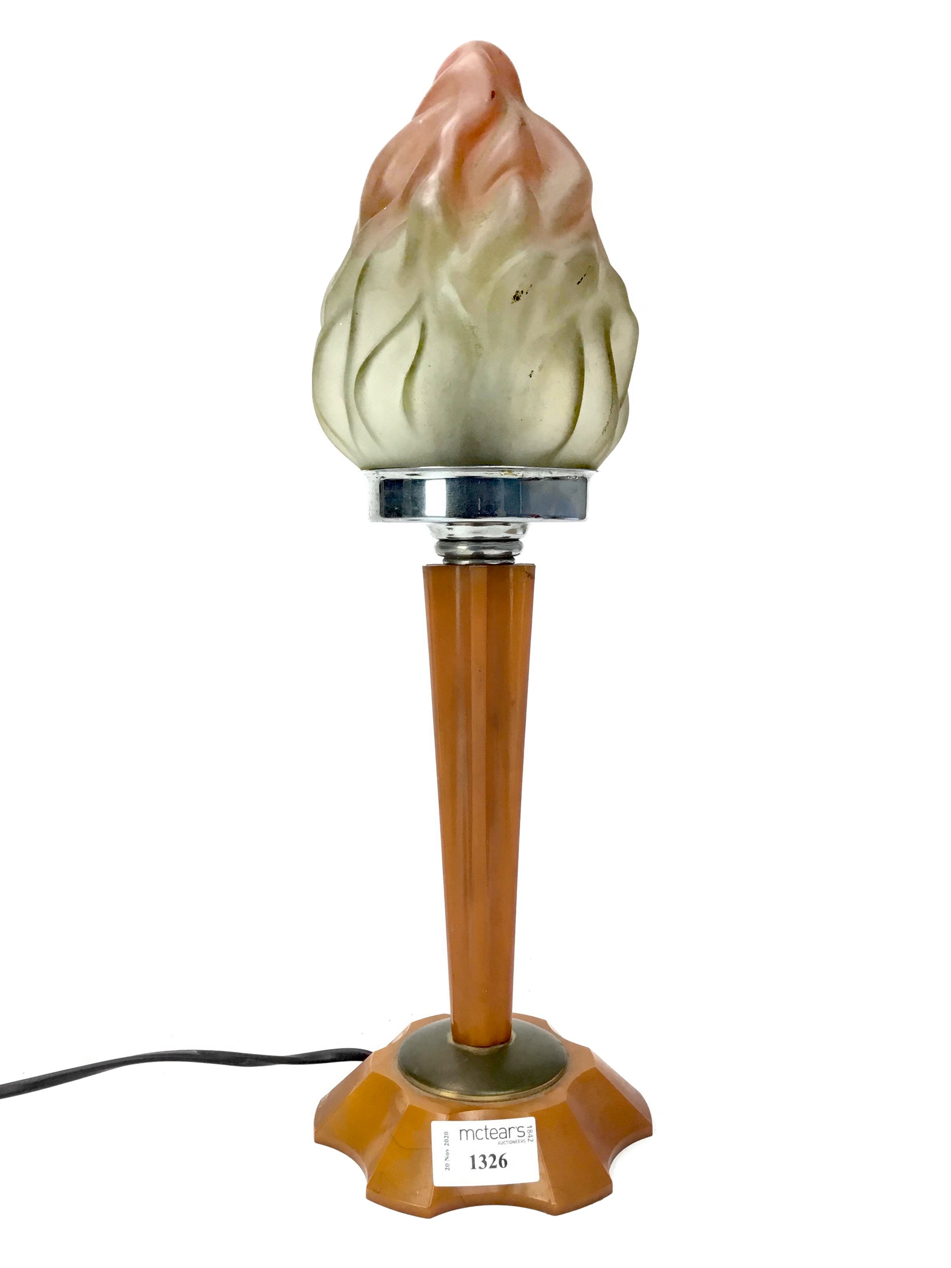 AN ART DECO TABLE LAMP WITH A GLASS FLAME SHADE
