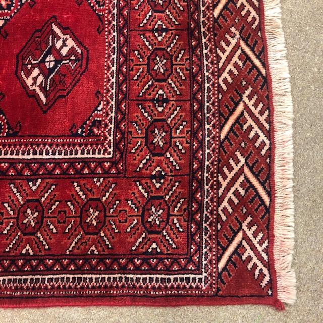 AN AFGHAN BOKHARA BORDERED CARPET - Image 2 of 2