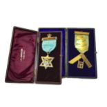 AN EDWARDIAN NINE CARAT GOLD MASONIC JEWEL AND ANOTHER