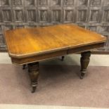 A VICTORIAN EXTENDING DINING TABLE