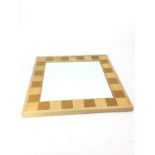 A SQUARE WALL MIRROR BY DAVID LINLEY