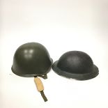 A BRITISH WWII TIN HAT ALONG WITH OTHER HATS