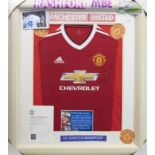 A SIGNED MANCHESTER UNITED FOOTBALL CLUB JERSEY