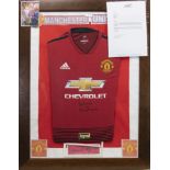 A SIGNED MANCHESTER UNITED FOOTBALL CLUB JERSEY