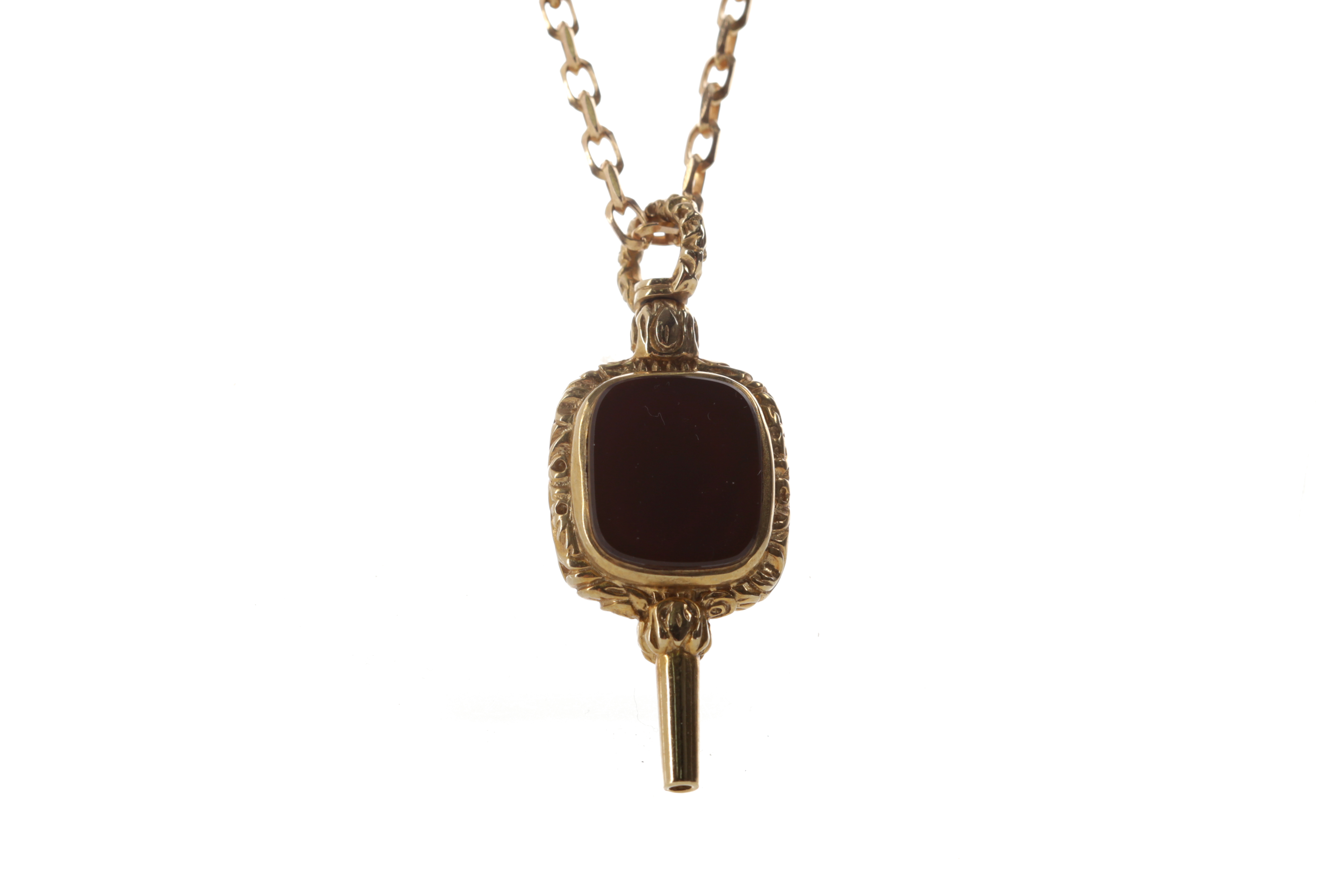 A HARDSTONE POCKET WATCH KEY ON A CHAIN