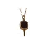 A HARDSTONE POCKET WATCH KEY ON A CHAIN