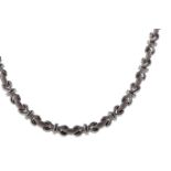 AN EIGHTEEN CARAT WHITE GOLD NECKLET AND BRACELET