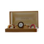 A LADY'S GUCCI GOLD PLATED QUARTZ WRIST WATCH