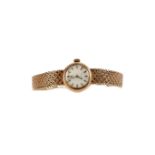 A LADY'S NINE CARAT GOLD OMEGA MANUAL WIND WRIST WATCH