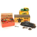 TWO SCHUCO TINPLATE CARS, ONE BOXED, A SCHUCO TINPLATE GARAGE No. 1500 AND A BOXED DINKY DIE CAST