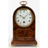 A BRASS INLAID MAHOGANY MANTEL TIMEPIECE WITH ENAMEL DIAL, THE MOVEMENT SIGNED ON THE ARCHED