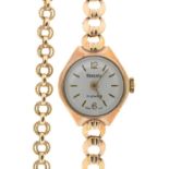 A REGENCY 9CT GOLD LADY'S WRISTWATCH ON 9CT GOLD BRACELET AND A GOLD CHAIN MARKED 9K, 17.5G