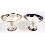 TWO COALPORT COBALT GROUND COMPORTS, DECORATED WITH ROSES, 24CM OVER HANDLES, PRINTED MARK, LATE