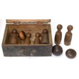 A SET OF VICTORIAN TURNED WOOD NINE PINS, TWO 'CHEESES' AND A BALL, IN BOARDED WOOD BOX, C1900