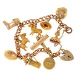 A 9CT GOLD CHARM BRACELET WITH NINE 9CT GOLD CHARMS, 40G, AND A GOLD PLATED HEART CHARM