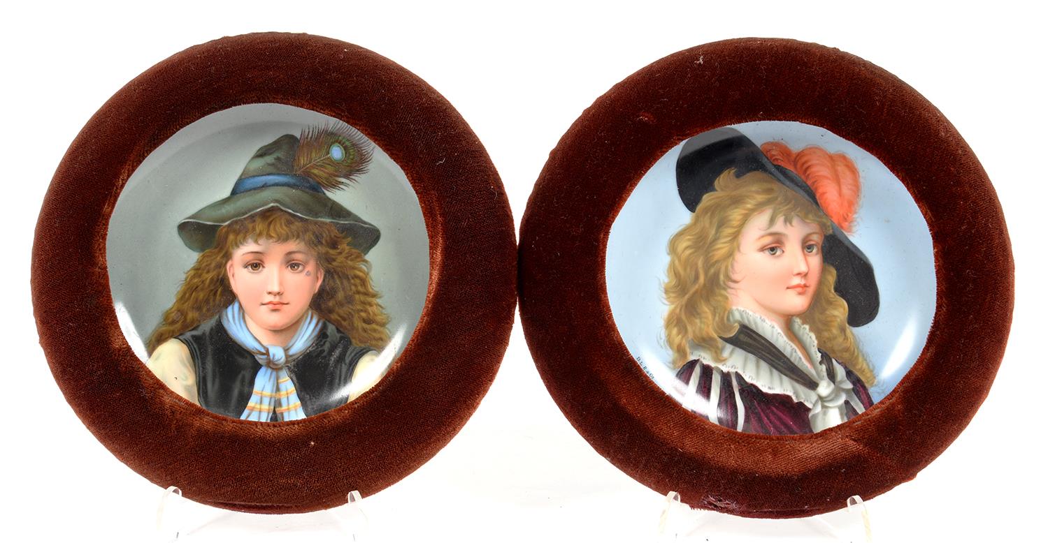 A PAIR OF CONTINENTAL PORCELAIN PLAQUES, PRINTED AND PAINTED WITH STUDIES OF A YOUNG CAVALIER AND