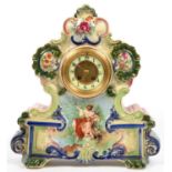 A CONTINENTAL PAINTED EARTHENWARE MANTEL CLOCK WITH ENAMEL DIAL, 45CM H