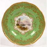 A COALPORT APPLE GREEN GROUND DESSERT PLATE, PAINTED BY E. O. BALL, SIGNED, WITH A SCOTTISH VIEW