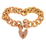 A GOLD BRACELET AND PADLOCK, MARKED 9CT, 20G