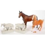 TWO BESWICK HORSES, PRINTED MARK AND A PAIR OF BISCUIT PORCELAIN GROUPS OF HORSES