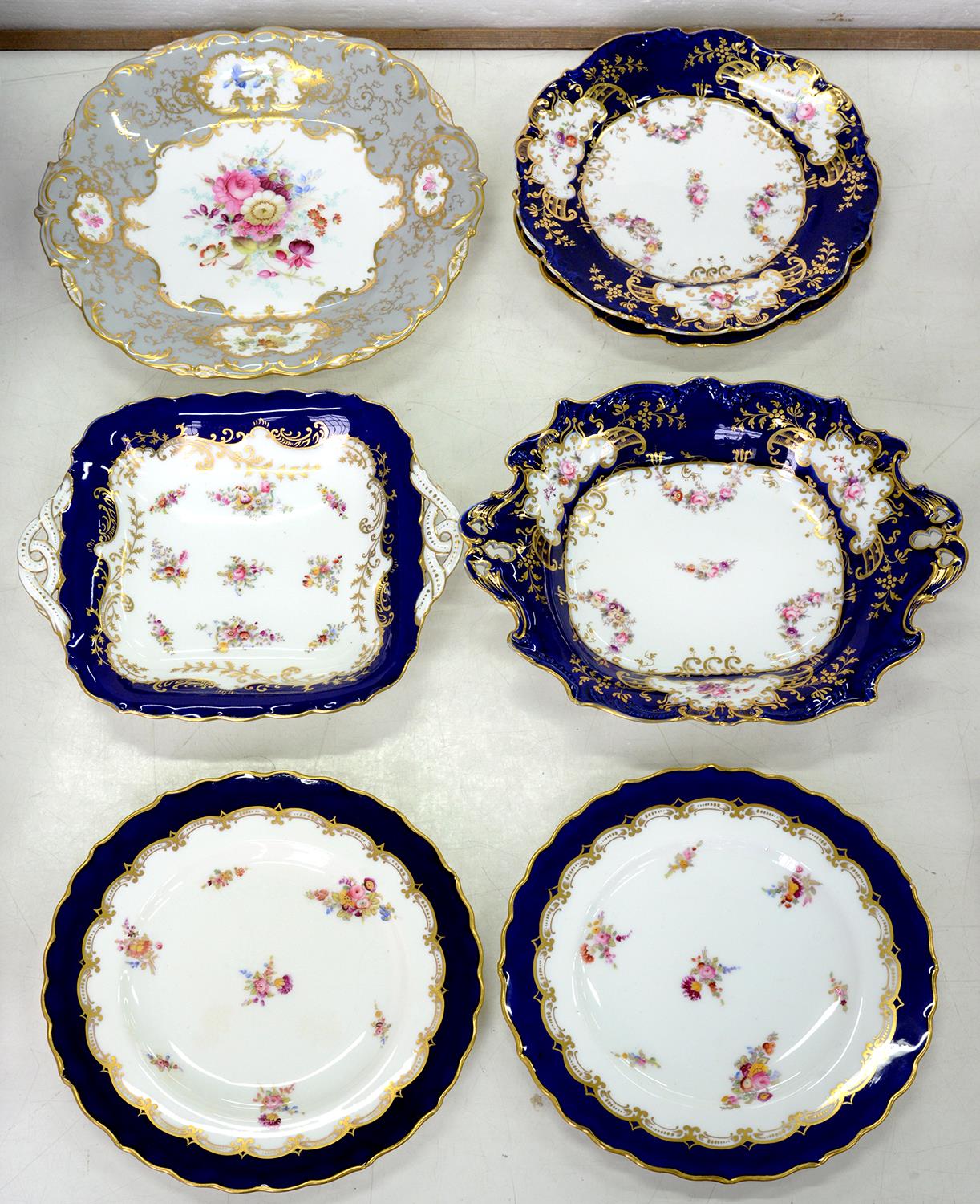 A PAIR OF COALPORT LIGHTLY MOULDED COBALT GROUND DESSERT PLATES AND A TWO HANDLED DISH WITH