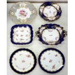 A PAIR OF COALPORT LIGHTLY MOULDED COBALT GROUND DESSERT PLATES AND A TWO HANDLED DISH WITH