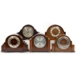 ONE WALNUT AND FOUR OAK MANTEL CLOCKS, C1930