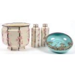 A ROYAL DOULTON OCTAGONAL EARTHENWARE JARDINIERE AND PAIR OF HEXAGONAL JARS AND COVERS EN SUITE,