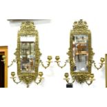 AN ORNATE PAIR OF VICTORIAN CAST BRASS GIRANDOLES OF FOUR LIGHTS WITH RECTANGULAR BEVELLED PLATE,
