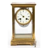 A FRENCH GILT BRASS FOUR GLASS MANTEL CLOCK WITH ENAMEL DIAL AND GONG STRIKING MOVEMENT, 25CM H,