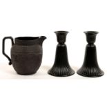 A WEDGWOOD BLACK BASALT JUG, MOULDED WITH ACANTHUS LEAVES AND SCROLLING FOLIAGE, 12CM H AND A PAIR