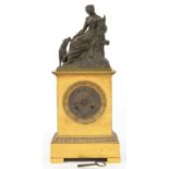 A FRENCH BRONZE AND ORMOLU MANTEL CLOCK, THE PILLAR CASE SURMOUNTED BY A SEATED FIGURE AND DOG,