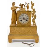 A FRENCH EMPIRE ORMOLU CLOCK, THE DIAL FLANKED BY ______________________ AND THYRSUS, SURMOUNTED