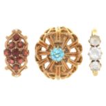 A GARNET CLUSTER RING IN 9CT GOLD, A ZIRCON RING IN 9CT GOLD AND ANOTHER GEM SET RING IN 9CT GOLD,
