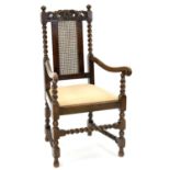 A CARVED AND TURNED OAK ELBOW CHAIR, EARLY 20TH C